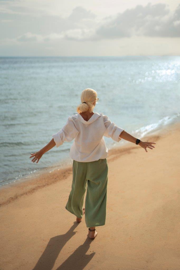 Woman enjoying a peaceful moment beside the sea